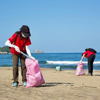 UL employee with trash pick up in Carson Beach South Boston