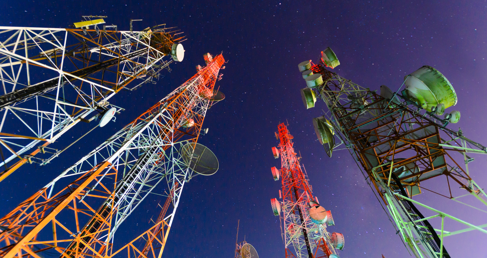The sky at night with communication towers