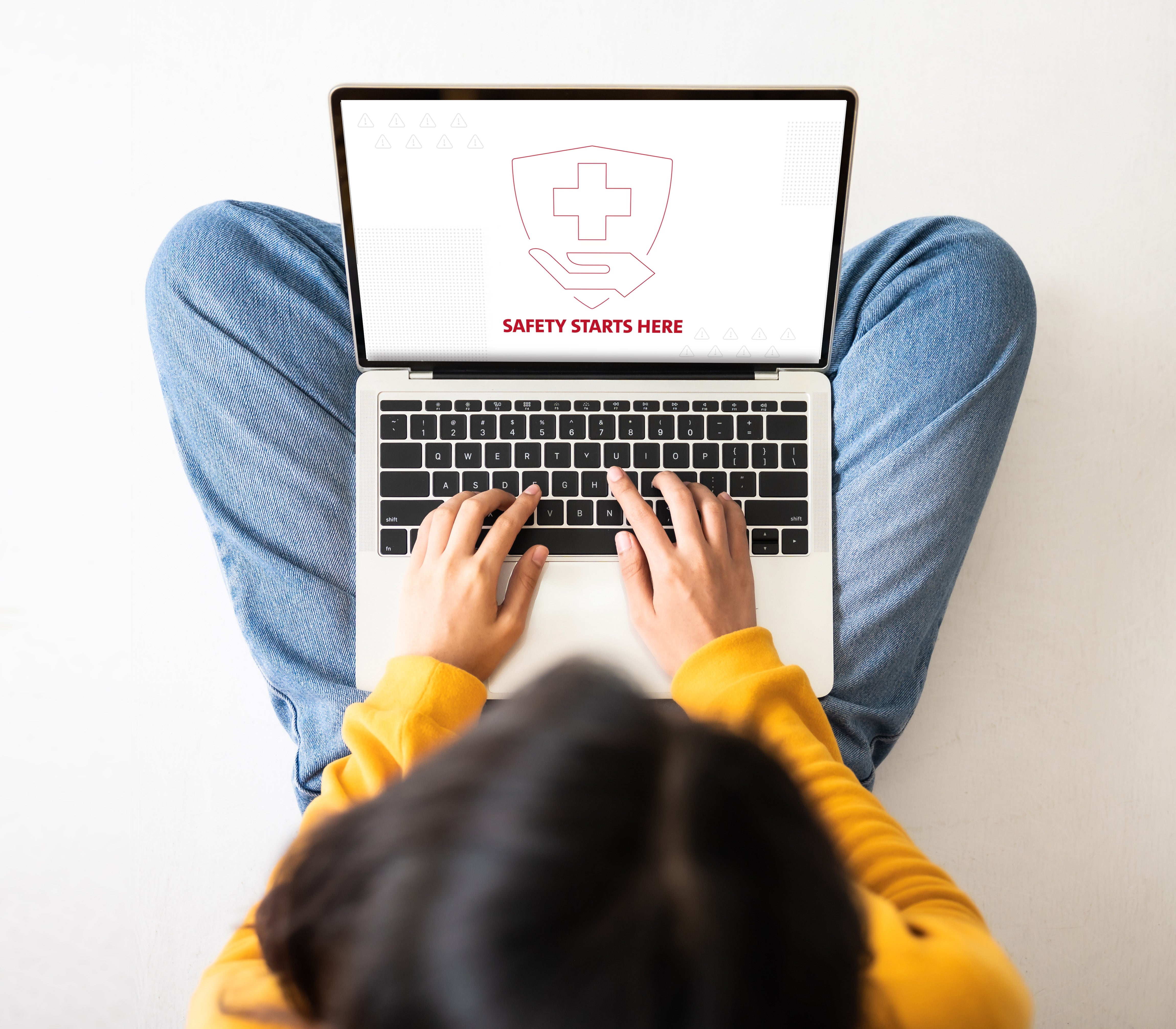 woman on laptop watching safety starts here video