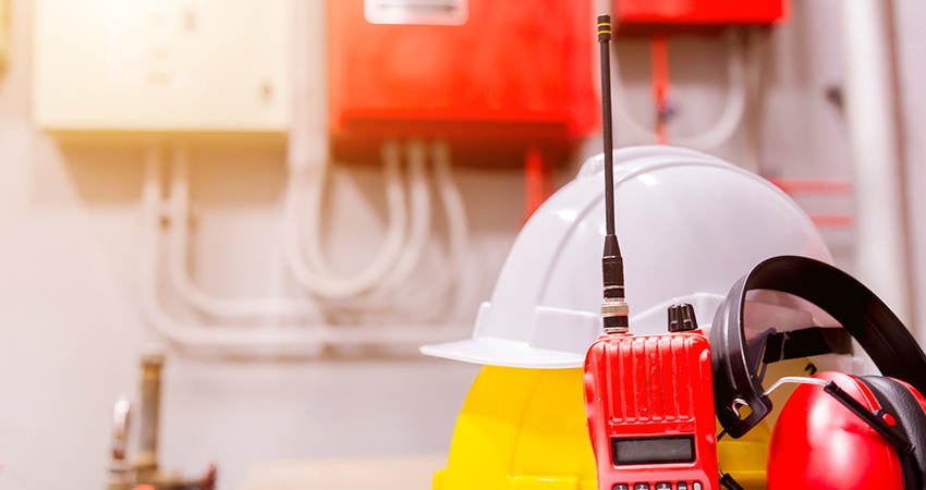 Standard construction safety equipment in a control room.