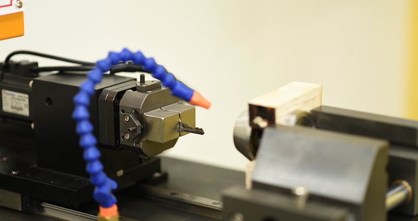 A lock cylinder being cycled to determine durability of the mechanism