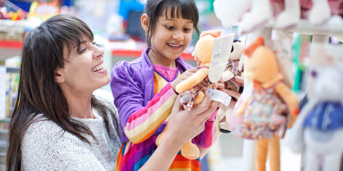Mother and child looking at toys