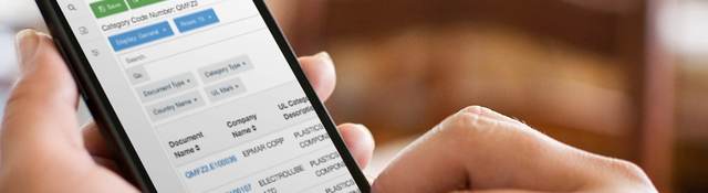 Product iQ site being viewed by someone holding a smartphone in her hand