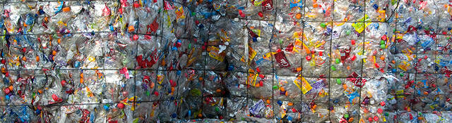 Cubes of crushed plastic bottles waiting for recycling
