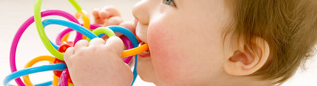 Baby playing with a teething toy 