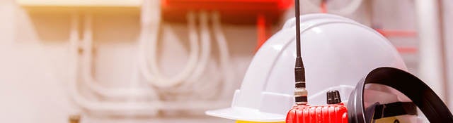 Standard construction safety equipment in a control room.