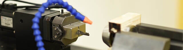 A lock cylinder being cycled to determine durability of the mechanism