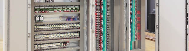 The inside of an industrial control panel board.