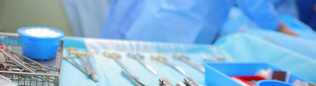 Sterile surgical equipment laid out on a tray in an operating room 