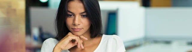 Woman sitting at her desk creating a compliant SDS. 