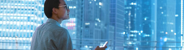 Guy on a roof with a smartphone