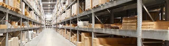 Row of shelves with boxes in warehouse