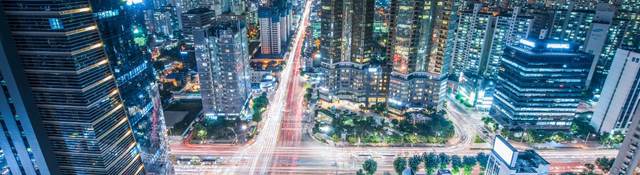 High Angle View Of Cityscape Lit Up At Night