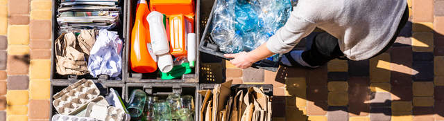 Woman sorts materials for recycling