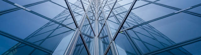 Modern blue glass building mirror reflections