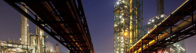 Pipelines at refinery at night
