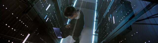 Top down view of man working in a data center 
