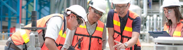 Safety personnel conducting equipment inspection