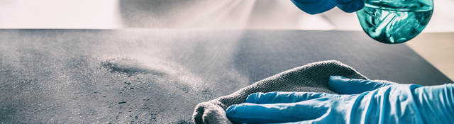 Cleaning table with spray and gloves