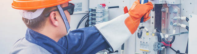 Engineer working on equipment and performing maintenance in a solar power plant