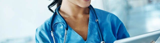 Nurse looking at a tablet
