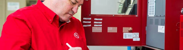 UL employee checking a fire alarm system