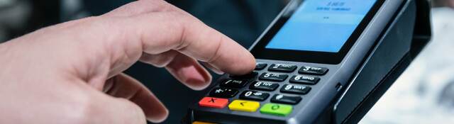 man using a payment terminal