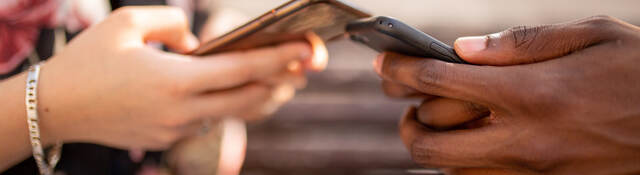 two people using mobile phone