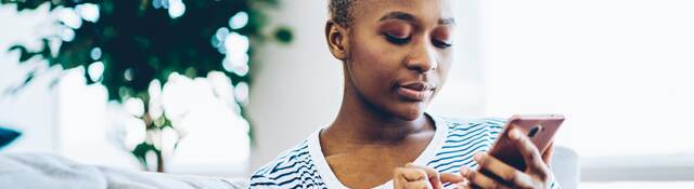 woman looking at a mobile phone