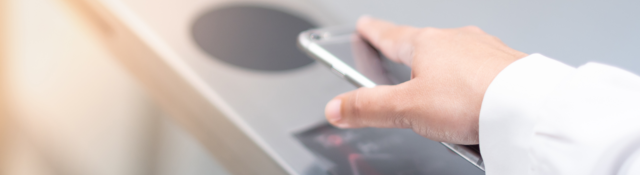 man placing a mobile phone on the reader