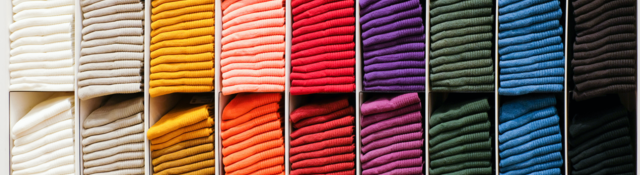 Colorful clothes on a retail shelf