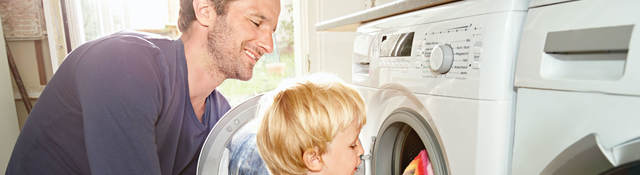 Father and son doing laundry