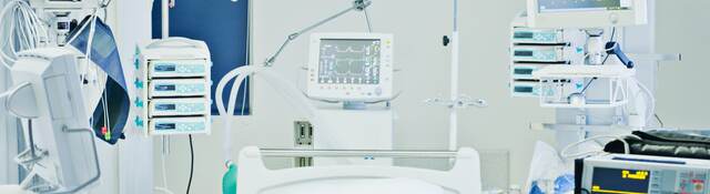 Empty hospital bed in intensive care