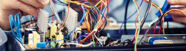 Electronics engineer repairs an audio/video device