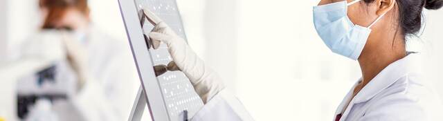 Scientist reviewing results on a computer