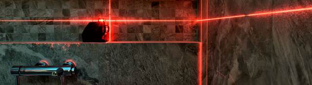 Laser measurement during bathroom renovation.
