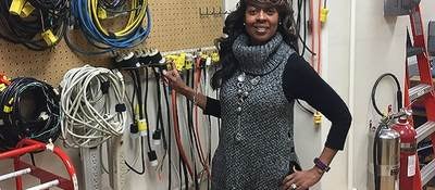 LeVette Martin stands before electrical equipment in UL lab