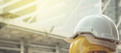 Image of yellow and white hard hats.