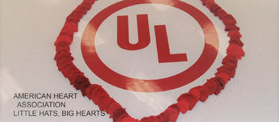 UL logo enclosed within red hats in the shape of a heart