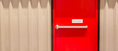 Red door with fire exit sign
