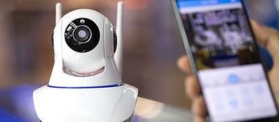 Small webcam with cell phone in foreground