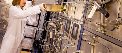 Female scientist working with equipment