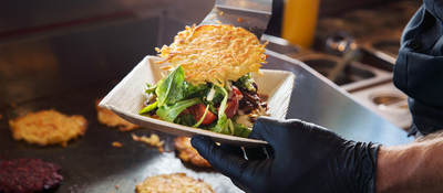 Person wearing gloves while preparing food
