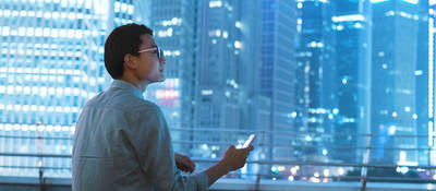 Guy on a roof with a smartphone