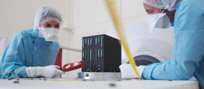 Medical technicians examine a medical device for safety