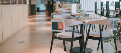 Safe workplace with socially distanced tables