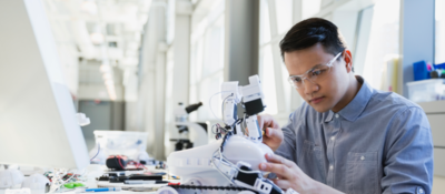Engineer assembling robotic car