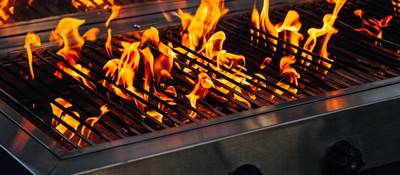 Barbecue gas grill with flames coming up 