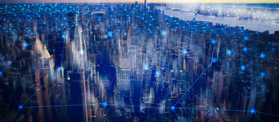 A city with blue interconnected lines showing digital connections.