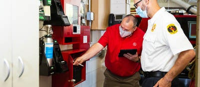 People inspecting a fire system